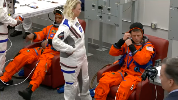 Astronauts step into their flight suits as Artemis II liftoff nears