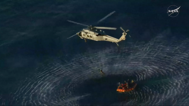 Artemis II crew hoisted into waiting Sea Hawks