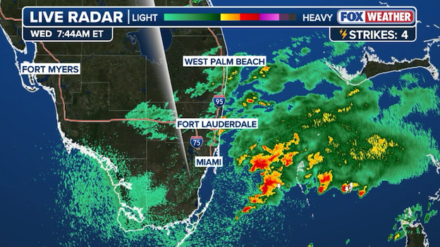 Torrential downpours churn off the Miami coast with lighter rain farther north