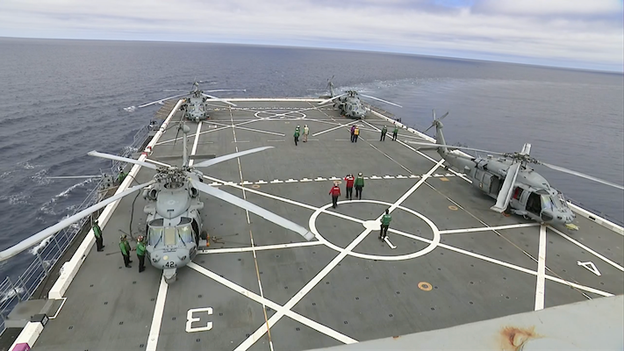 Coordinating the final approach for the Navy’s elite recovery team