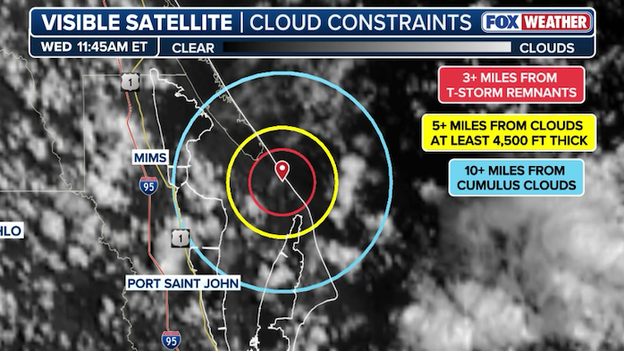 Clouds bubble up over Kennedy Space Center as meteorologists monitor launch rules