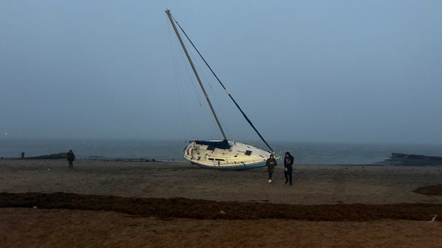 Sailboat breaks loose, washes ashore as nor’easter batters Massachusetts