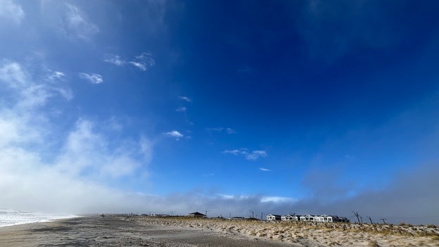 Eye of the storm: Clear blue skies briefly emerge over Seaside Heights, NJ