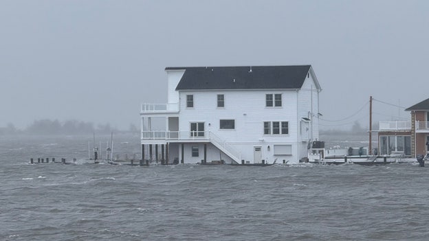 Storm surge spills into back bays near Island Beach State Park