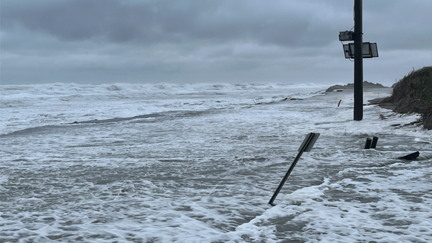 4 feet of water and deep sand submerge Highway 12 on Pea Island