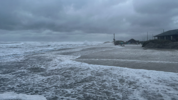 4 feet of water and deep sand submerge Highway 12 on Pea Island