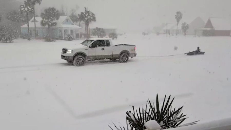 Louisianans drag kayak behind truck in historic winter storm