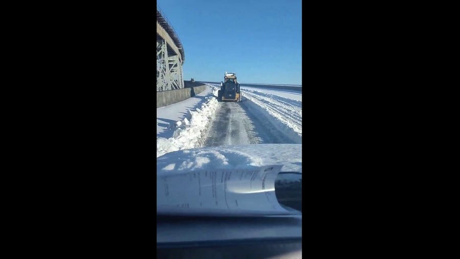 Crews in New Orleans work to dig out the snow after an historic snowstorm