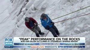 Rappelling down an icy waterfall at the FOX Weather Ski House