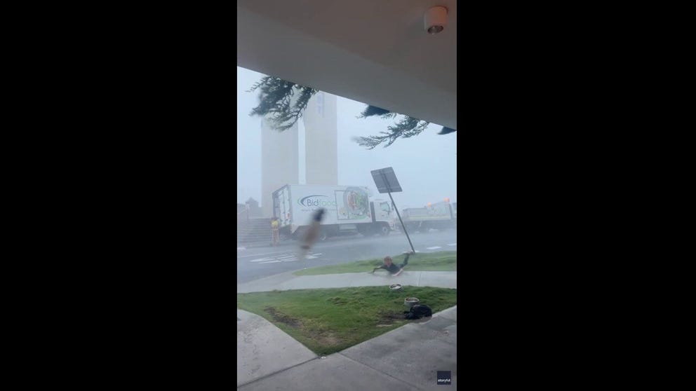 Parts of eastern Australia were hit by a storm on Thursday, causing strong wind gusts. A video captured in Queensland shows the storm, and the moment winds rip the surfboard from a surfer's hands and knock the surfer to the ground. 