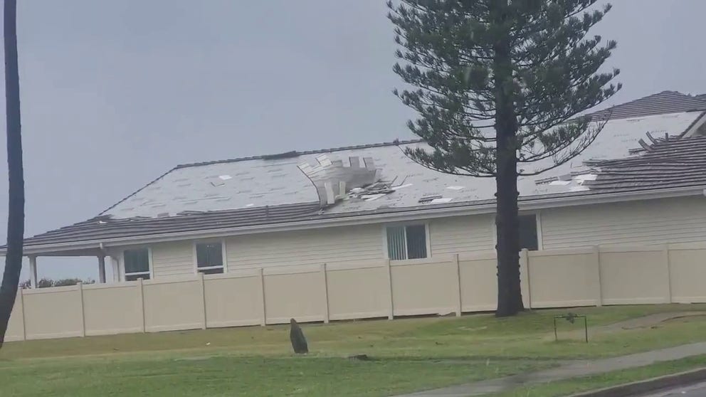 Strong winds blow shingles on roof in Kaneohe, HI along the windward coast of Oahu. This was part of a storm that brought heavy rain and wind across the islands.