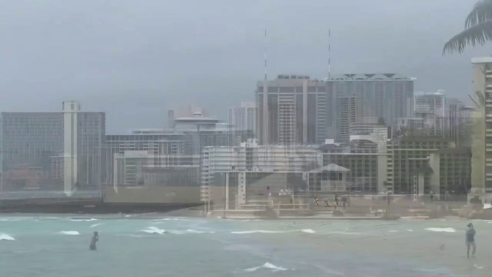 Strong winds churn major waves on Kaimana Beach in Honolulu, HI part of a heavy-hitting storm that brought rain, wind and snow to the islands (Video Credit: @hawaii_isla808/X).