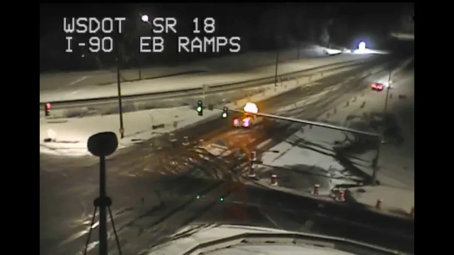 Ice partially cleared from SR-18 Tiger Mountain Pass west of Seattle, WA after atmospheric river dumped snow and ice