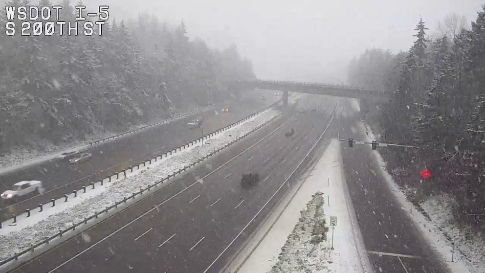 Snow flurries fall in Seatac in Washington on Interstate 5 as Atmospheric River moves through (Video Credit: @wsdot_traffic).