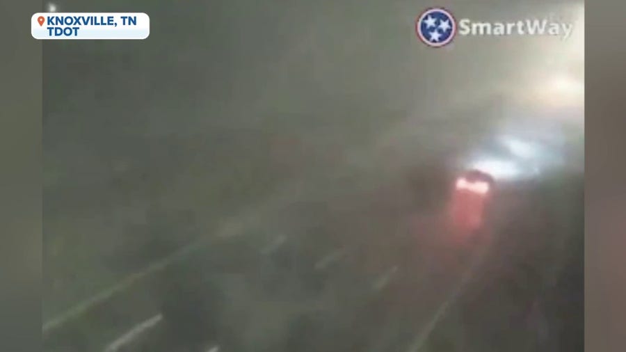 Traffic camera in Knoxville, TN shows driving wind and lightning amid tornado-warned storm