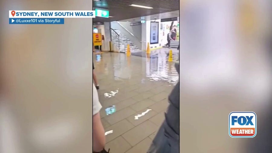 Watch: Train station transforms into waterfall after wild storm lashes Sydney