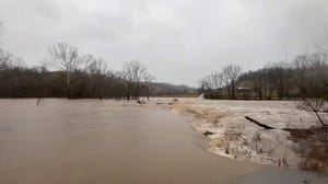 Watch: Major flooding washes away trees in Madison County, Kentucky