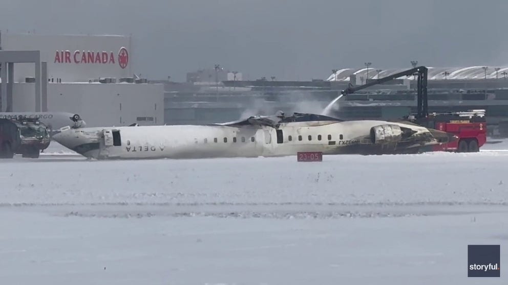 Footage shows the plane lying upside down as first responders race to the location.