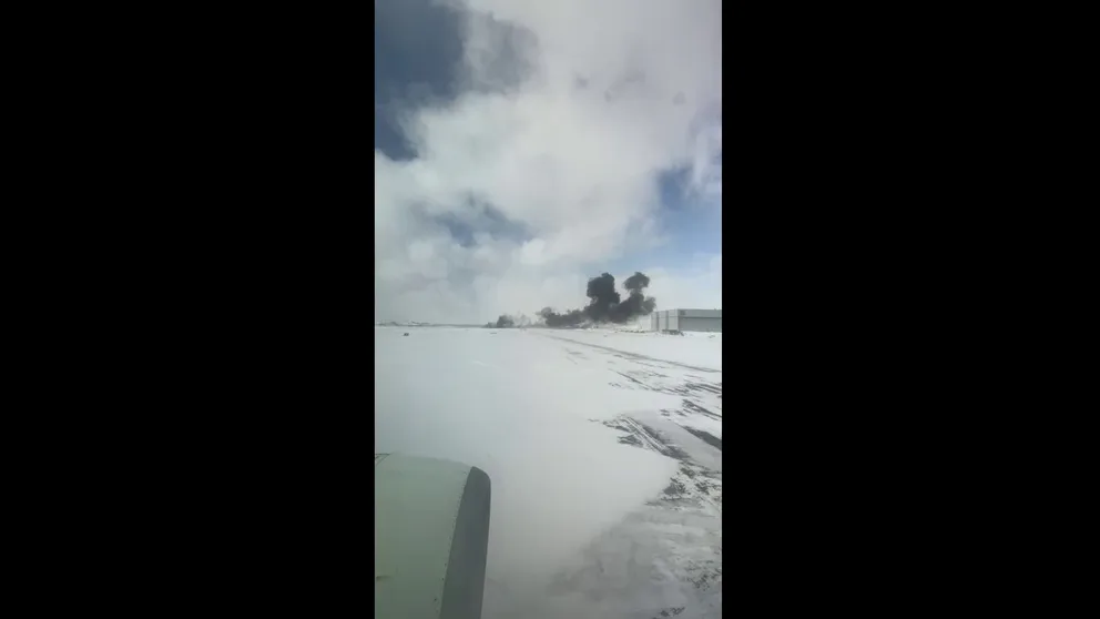 A video recorded in Toronto shows smoke billowing from a Delta Air Lines airplane after it crashed on Monday, Feb. 18, 2025. The flight originated from Minneapolis-Saint Paul International Airport.