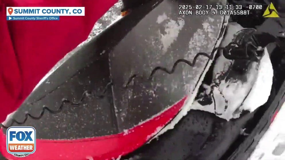 Police bodycam footage shows the harrowing rescue of a snowmobiler who was buried by an avalanche in central Colorado on Monday.