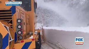 Snow plows clear wall of snow in Oswego County, New York