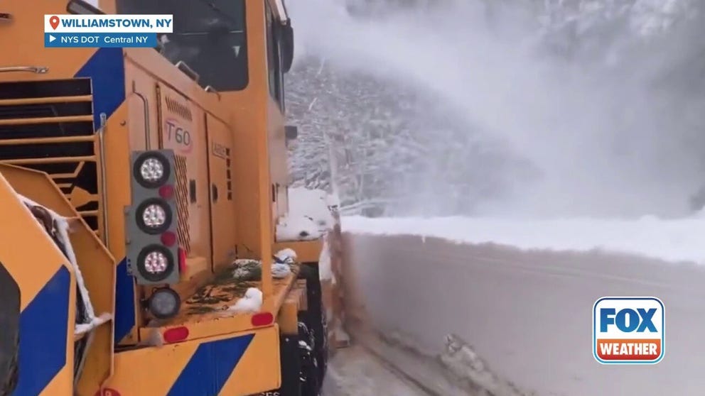 A lake-effect snow storm dumped feet of snow across Oswego County, New York last week. Department of Transportation crews in Central New York were busy clearing walls of snow like this to make way for cars -- and more snow.