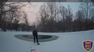 Two Police officers in Ohio save a dog that had fallen through a frozen pond