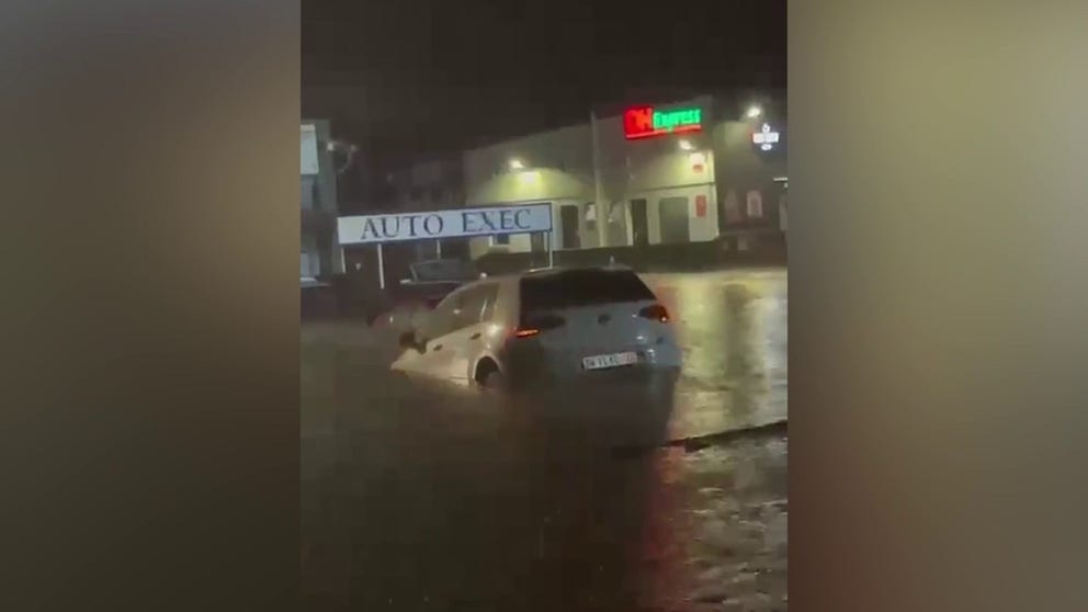 Video shot on the southern coast of South Africa's KwaZulu-Natal province shows a car floating in floodwater after torrential rains hit the area.