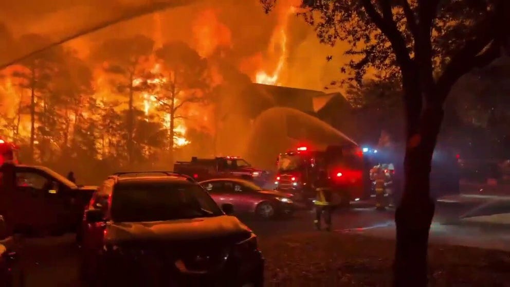 Residents of Carolina Forest were under evacuation orders over the weekend as wildfire erupted nearby. Video from Sunday night shows firefighters battling a wall of fire near houses in the city.