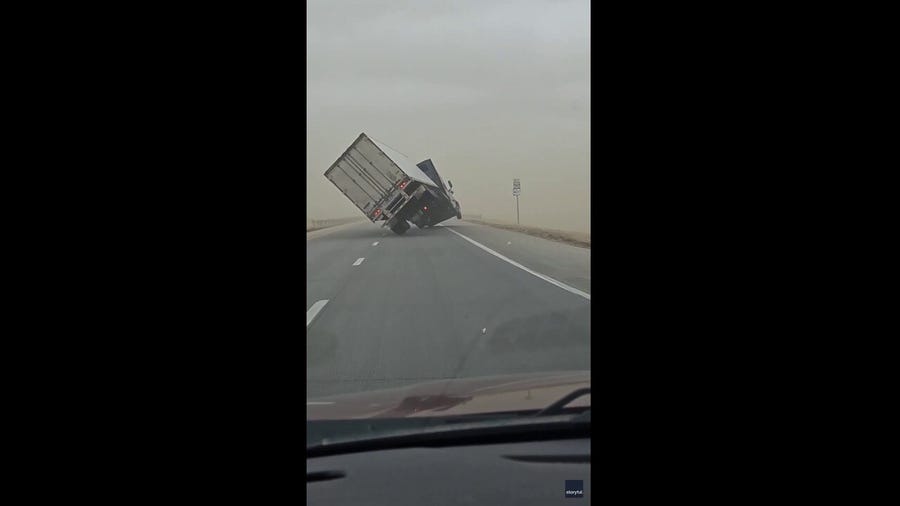 A semi-truck driving outside of Garden City, Kansas was flipped over due to extreme winds in the area.