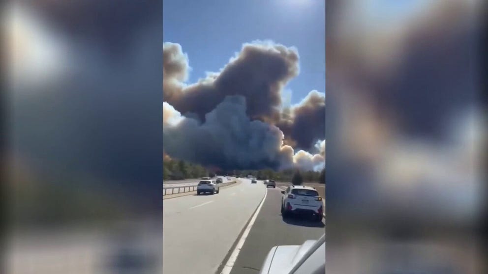 A video shared from New York shows thick black smoke filling the air over Sunrise Highway in Suffolk County as massive brush fires burn on Long Island on Saturday, March 8, 2025. 