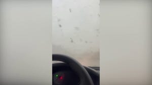 Florida tornado hurls debris at car with woman stuck inside