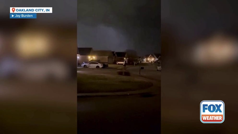 Video footage from Jay Burden in Evansville documented a tornado's path towards Oakland City, Indiana. The storm left a trail of destruction across Gibson County, with widespread reports of downed trees, power lines and utility poles, according to authorities.