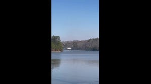 Video: Chinook helicopter scoops up water to fight Western North Carolina wildfires