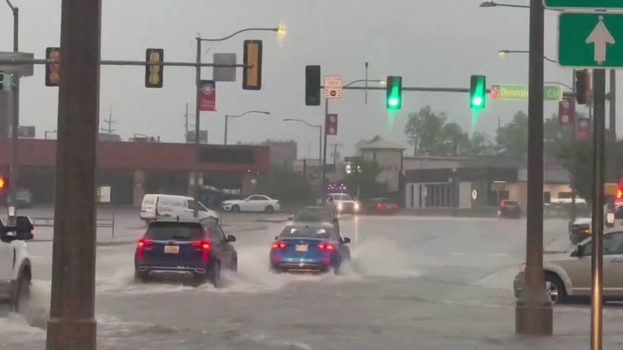 Watch: Cars drive through flooded street in Central Oklahoma