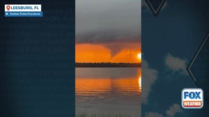 Sunset waterspout forms near Leesburg, Florida amid drenching storms