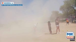 Watch: Dust devil interrupts little league softball game in Illinois