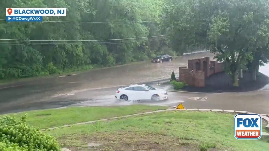 Watch: Cars drive through flooded streets in New Jersey
