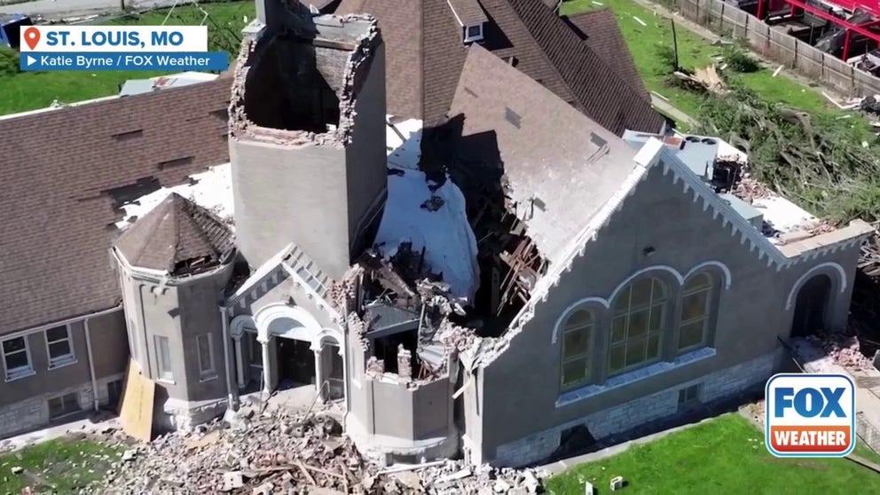 Drone footage shot over St. Louis shows parts of the roof of Centennial Christian Church collapsed, as nearby homes had their roofs pulled off and walls collapsed.