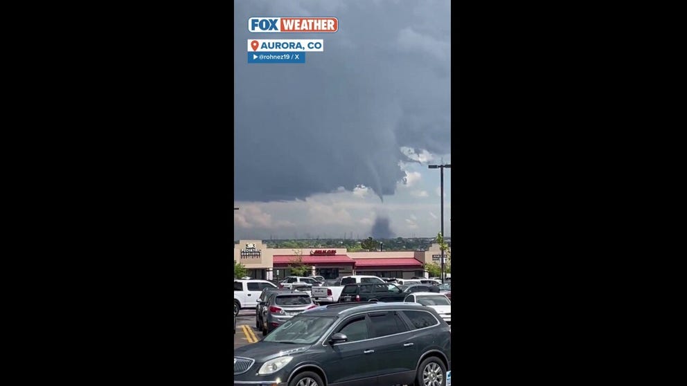 People in Aurora observed the large tornado move around the city, and the National Weather Service issued a tornado warning for other communities in the area.