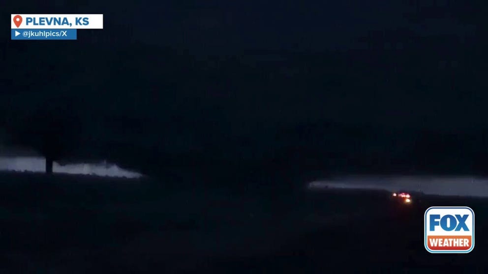 A video shared from Plevna, Kansas, shows a massive wedge tornado being illuminated by flashes of lightning as it spins across the landscape on Monday, May 19.