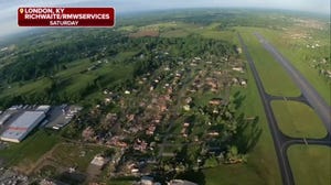 A bird's-eye view from the air reveals the scope of tornado damage to the London-Corbin airport and surrounding communities in London, Kentucky