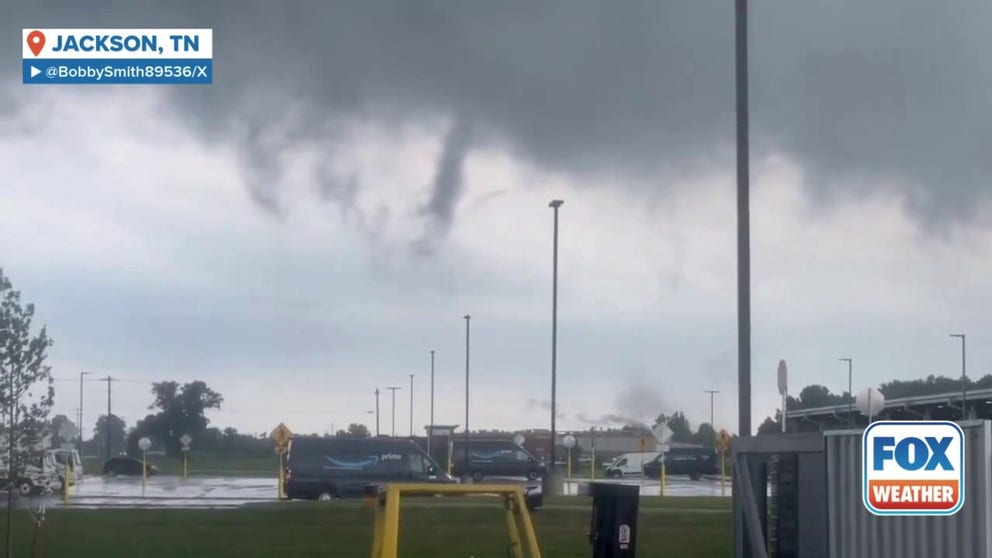 Video shows a tornado causing damage when it touched down near the airport in Jackson, Tennessee, on Tuesday.