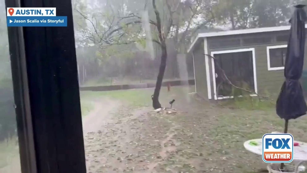 An Austin backyard was flooded and slammed with hail during severe thunderstorms Wednesday afternoon. 