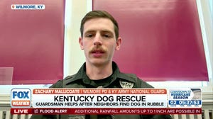 U.S. National Guard Soldiers jump into action and save a family dog trapped under a heap of debris from a tornado in Kentucky