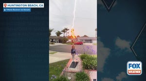 Watch: Lightning strikes house behind child in California