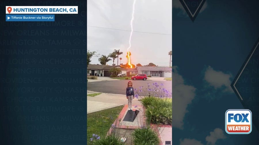 Watch: Lightning strikes house behind child in California