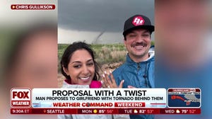 Storm-chasing couple gets engaged with tornado raging behind them