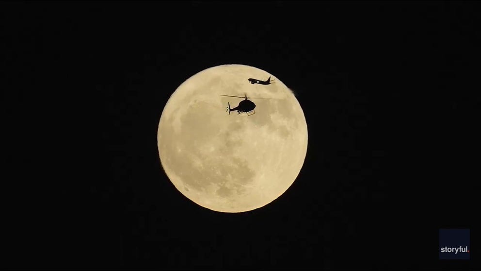 A photographer captured this transportation scene unfolding in front of the full Moon over Chicago on Tuesday night. 