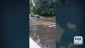 Watch: Cars drive through flooded streets in Philadelphia